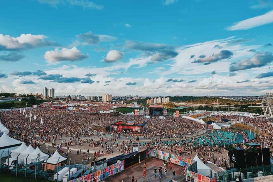 A poster for the 2023 Lollapalooza music festival in Chicago. The poster features a colorful background with the words "Lollapalooza 2023" in large letters. There are also images of musical instruments, people dancing, and the Chicago skyline.